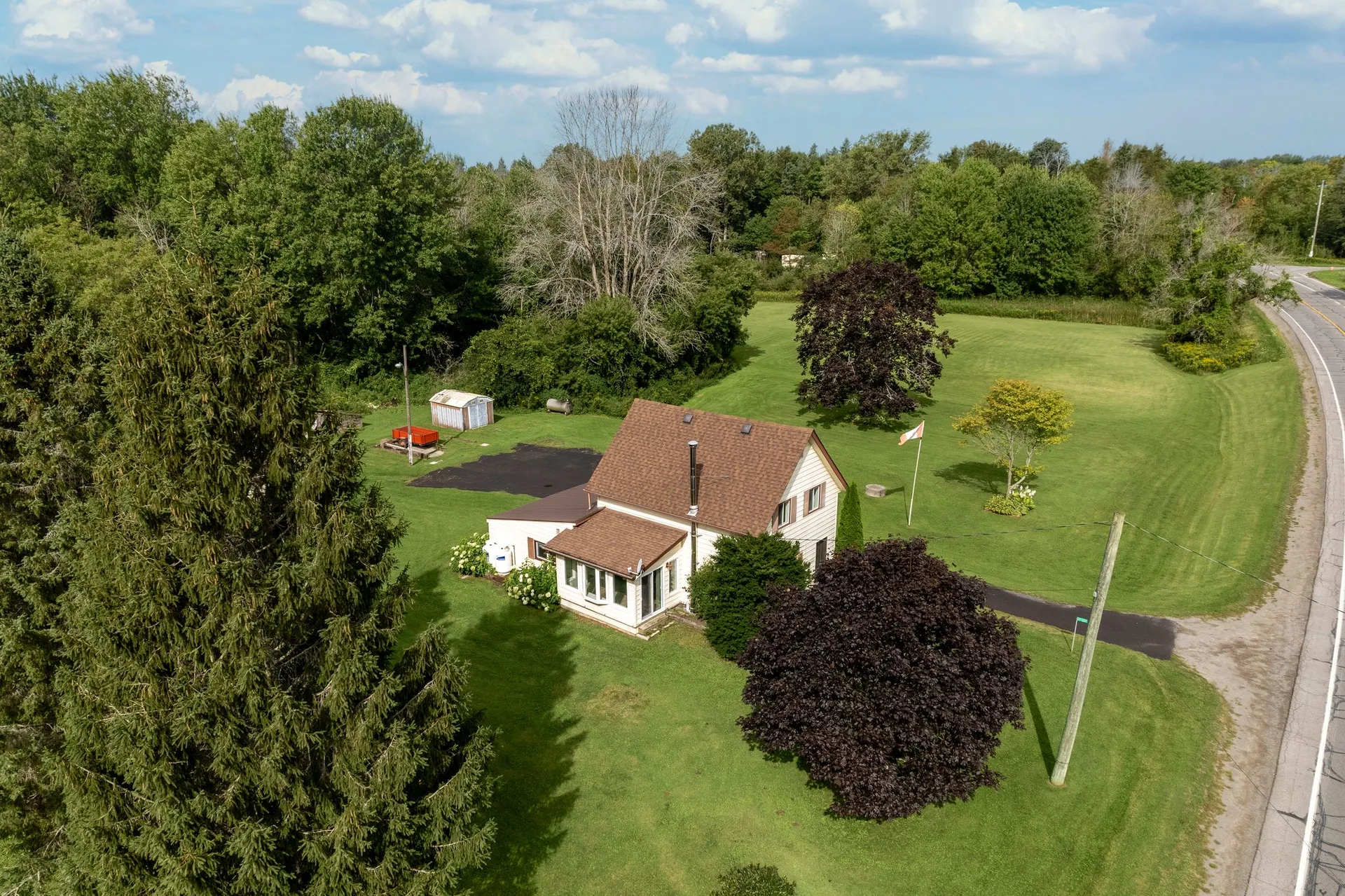 Aerial overview of farm property and surrounding land, 21331 Loyalist Pkwy