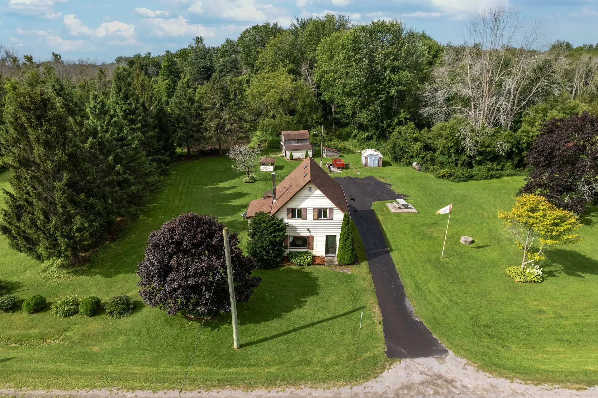 Private driveway entrance to 21331 Loyalist Pkwy farm property