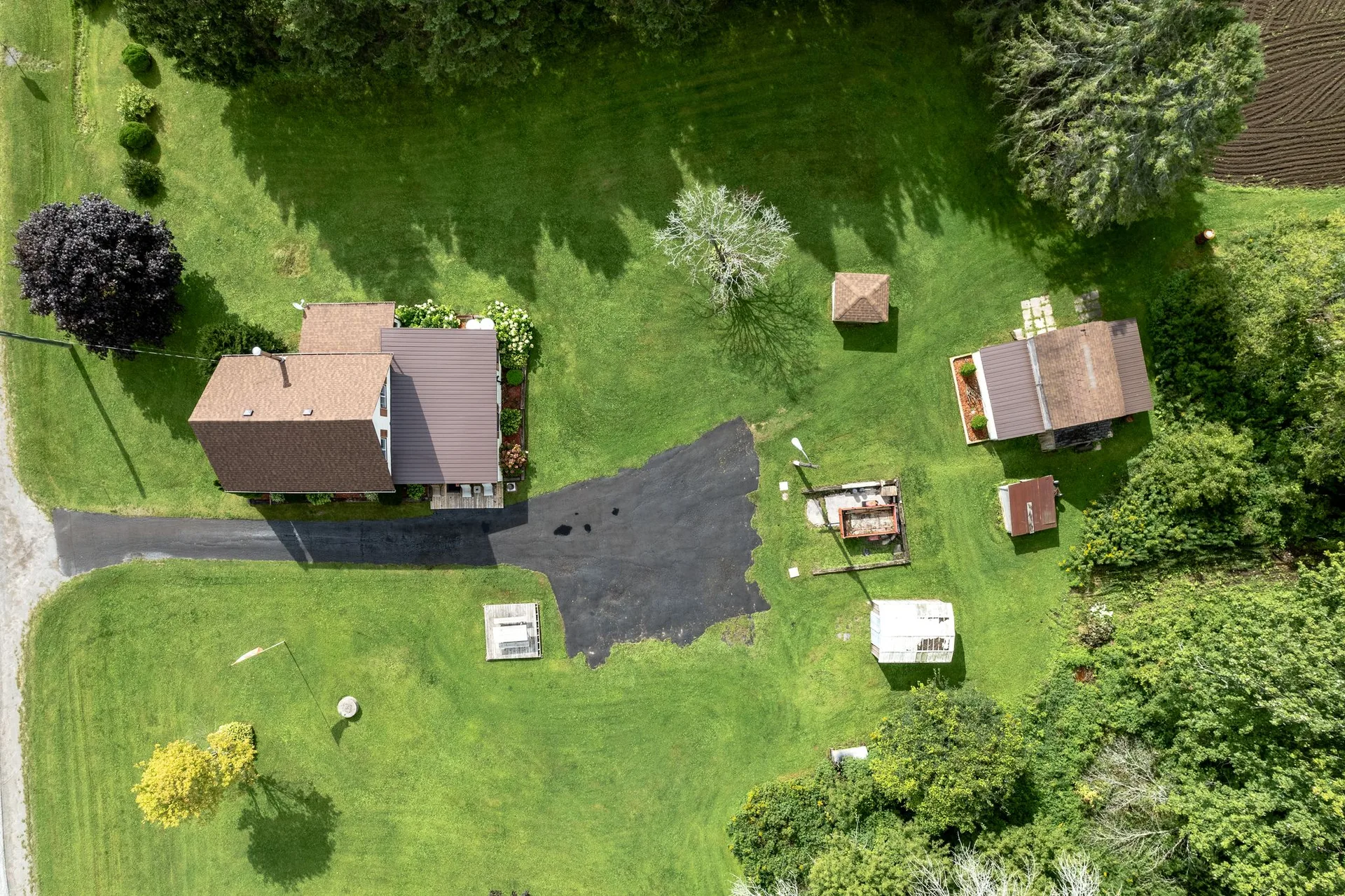 Rear exterior and deck overlooking farm grounds, 21331 Loyalist Pkwy