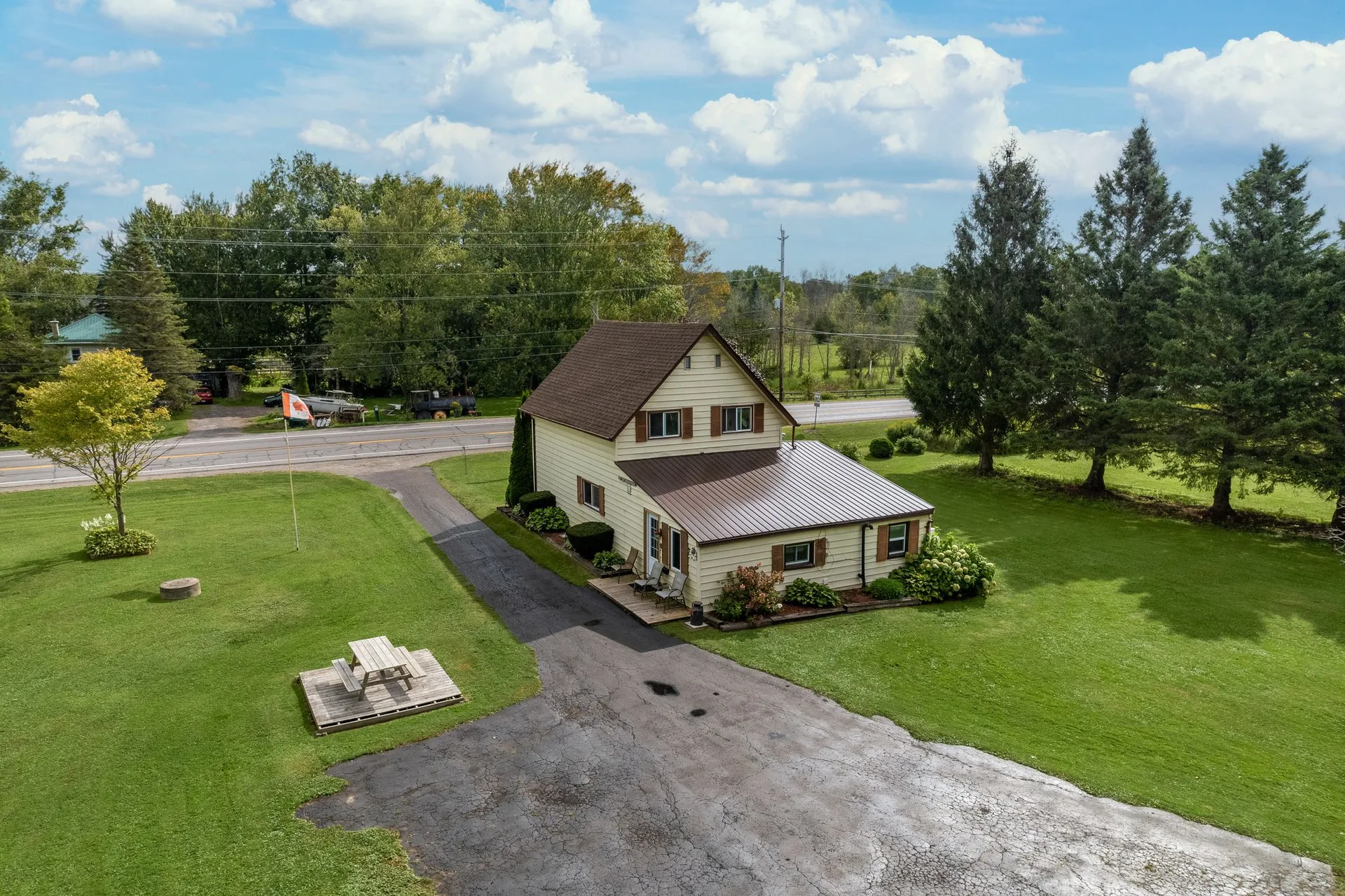 Drone view showing property depth and agricultural land