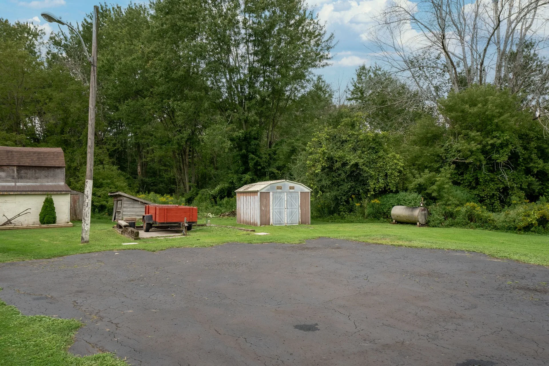 Farmyard overview showing outbuildings and open land