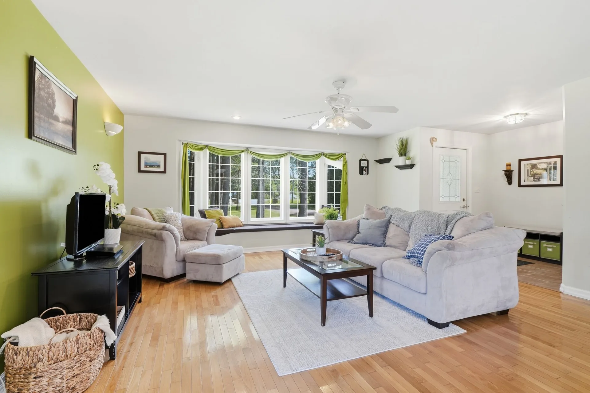 Open-concept living room with bay window at 21627 Loyalist Parkway, Carrying Place, PEC