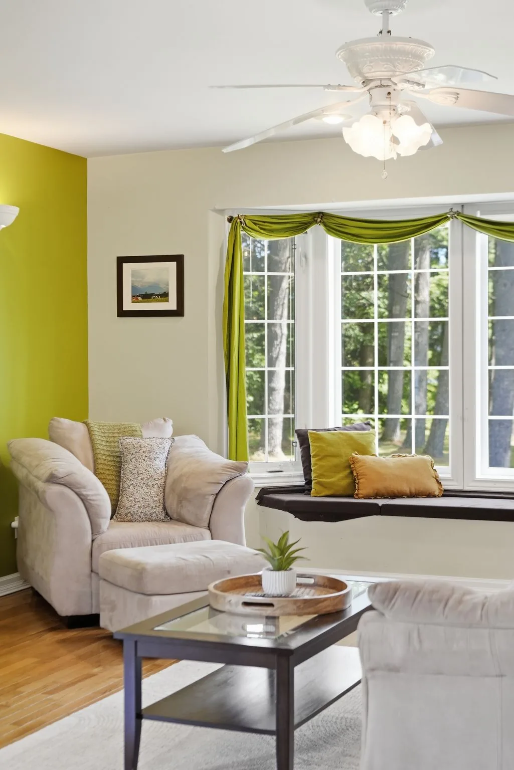 Living room seating area with large windows at 21627 Loyalist Parkway, Prince Edward County