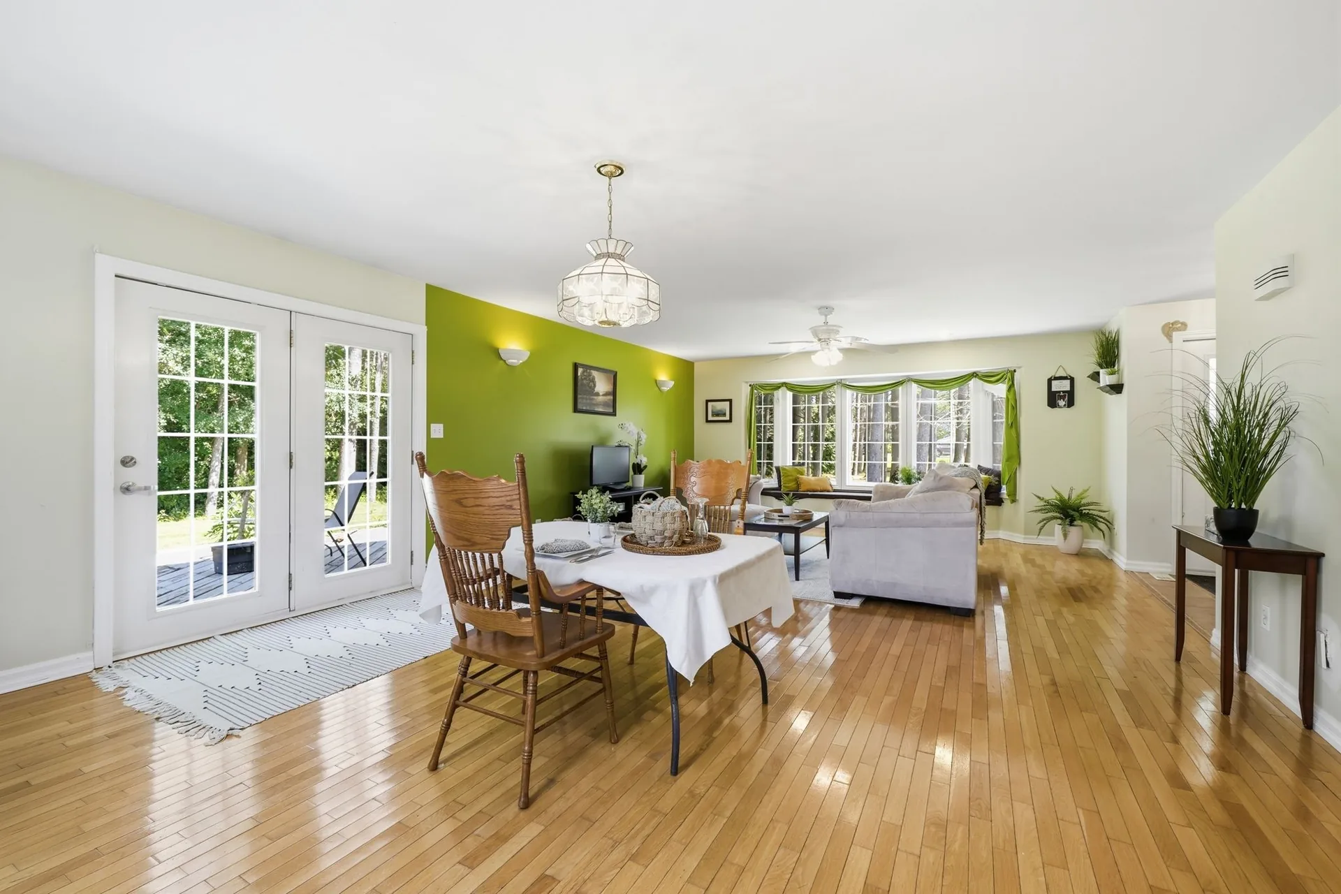 Dining area with French doors to the backyard, open to the living room, at 21627 Loyalist Parkway, Carrying Place