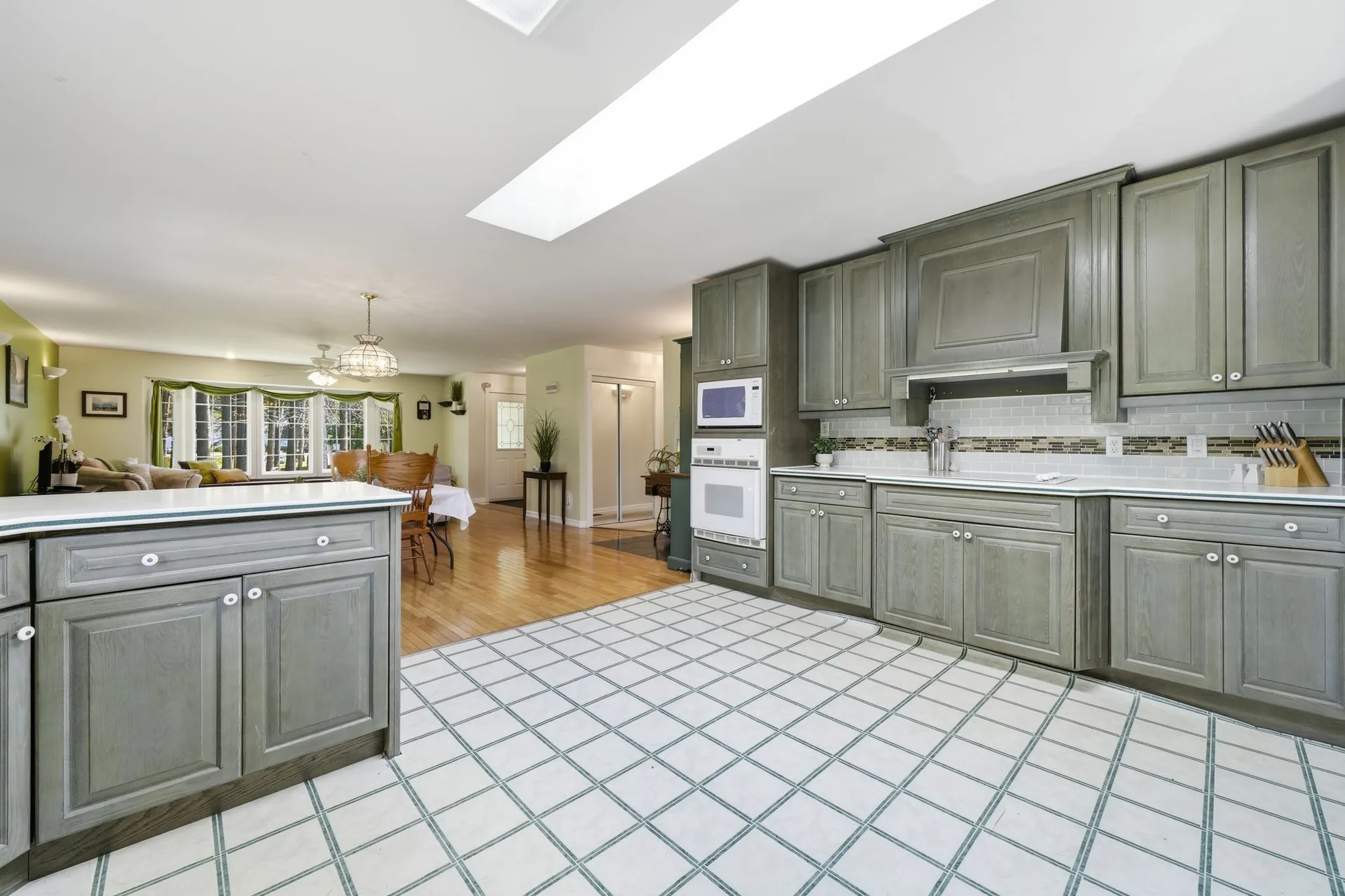 Open kitchen with skylights looking toward the dining area at 21627 Loyalist Parkway, Carrying Place, PEC