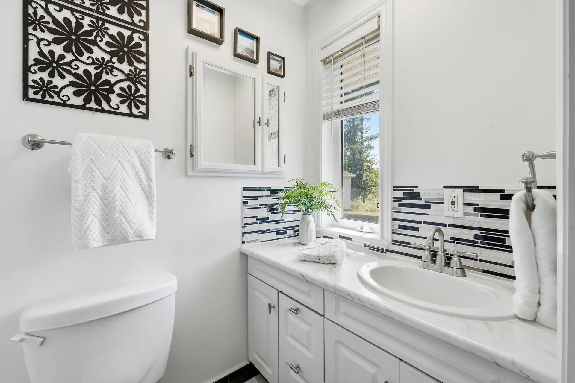Full bathroom vanity and mirror at 21627 Loyalist Parkway, Prince Edward County