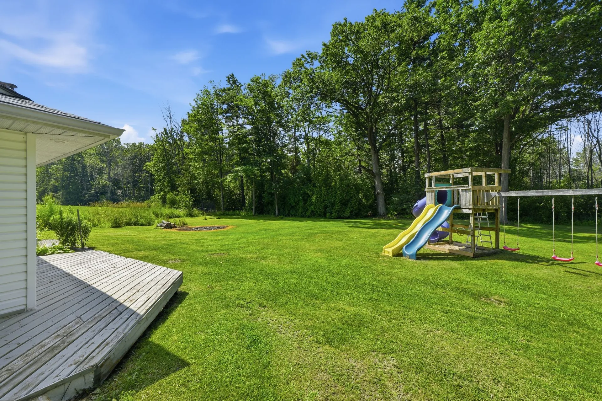 Backyard with mature trees and open green space at 21627 Loyalist Parkway, Carrying Place, PEC