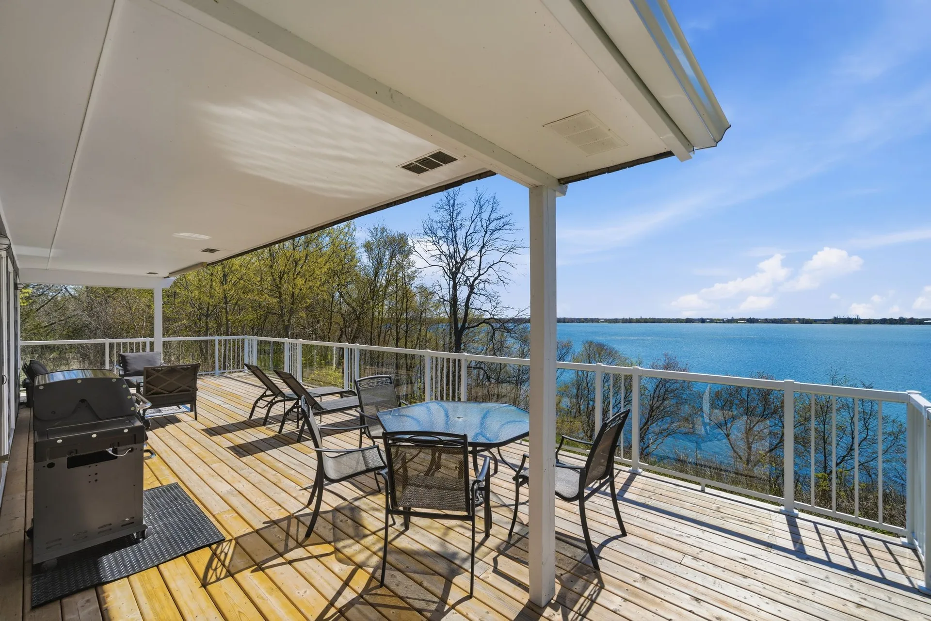 86 Colliers Road cottage exterior from the waterfront side, South Bay, Prince Edward County