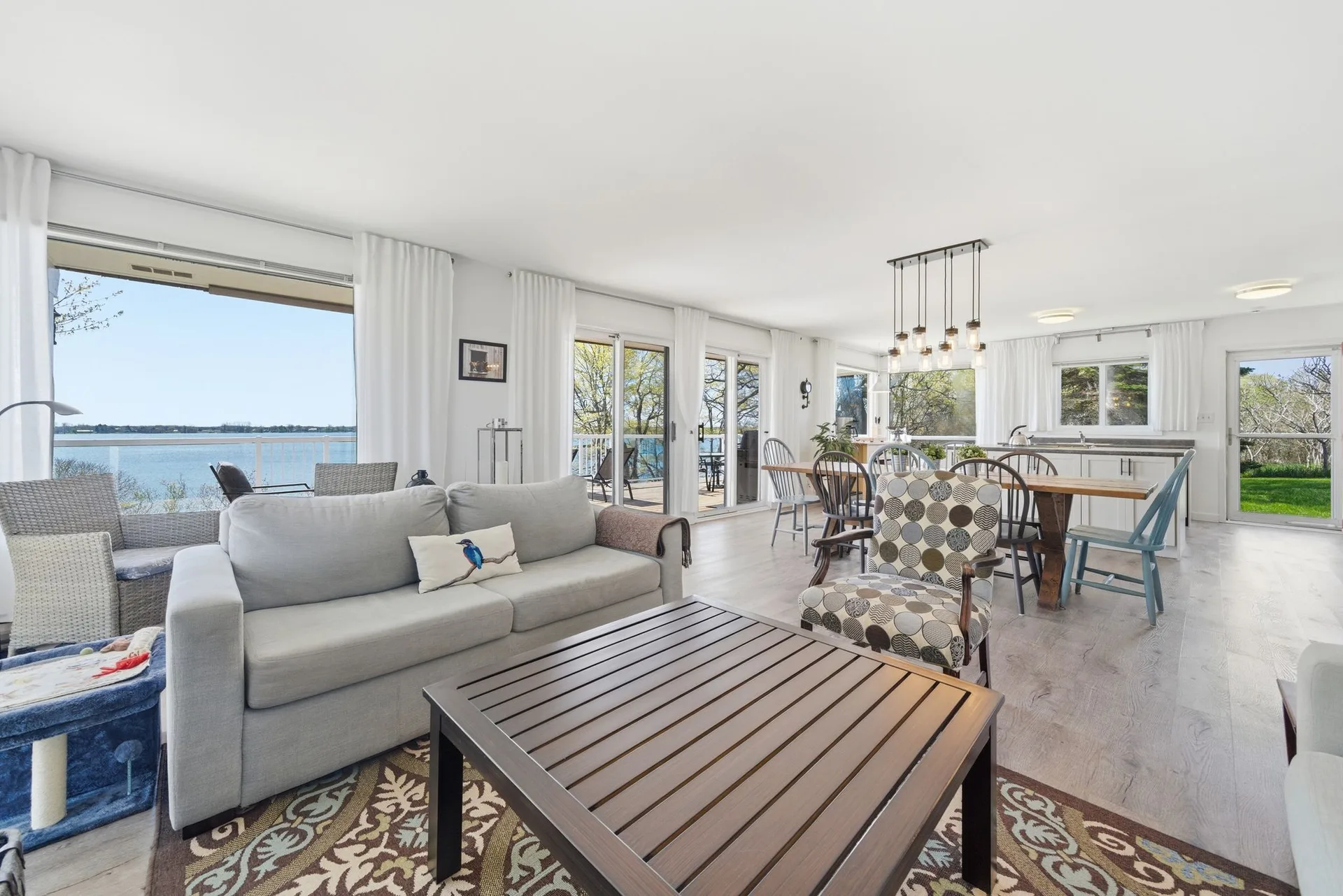 Open-concept living and dining room with South Bay water views, 86 Colliers Road, PEC