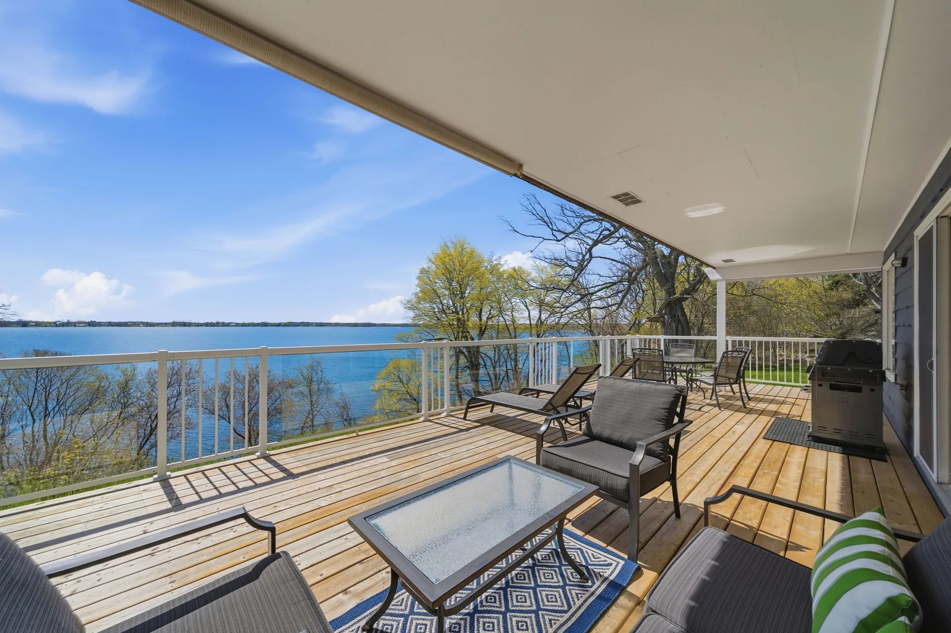 Deck and yard at 86 Colliers Road, waterfront cottage, Prince Edward County