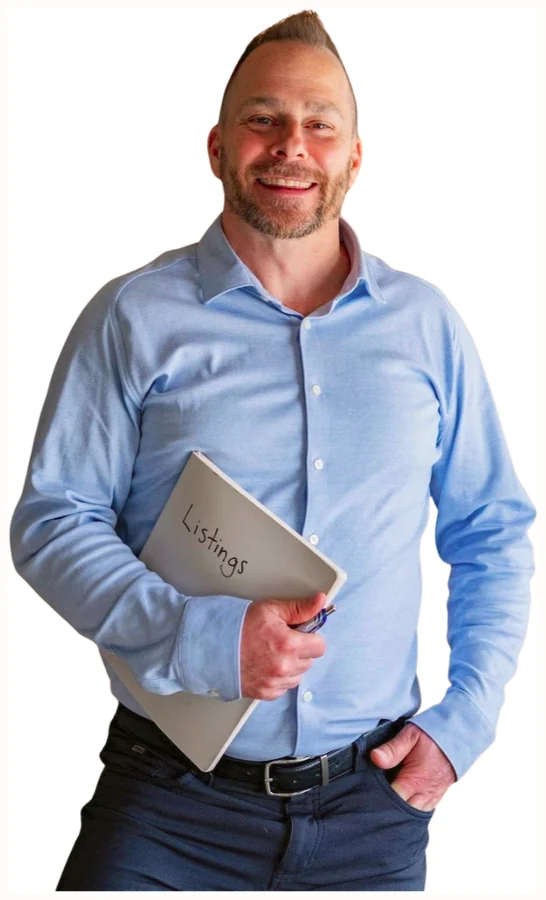 Jake Bergeron holding his Listings binder, Prince Edward County real estate Sales Representative